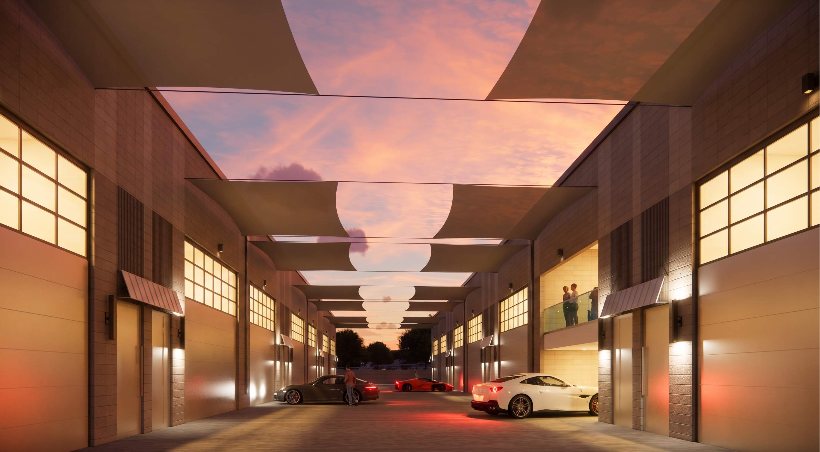 Garage suite drive aisle at dusk at Motor-Vault Shea and 101, conceptual rendering